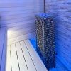HUUM Cliff Electric Sauna Heater showcased in Blue Light