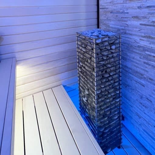HUUM Cliff Electric Sauna Heater showcased in Blue Light