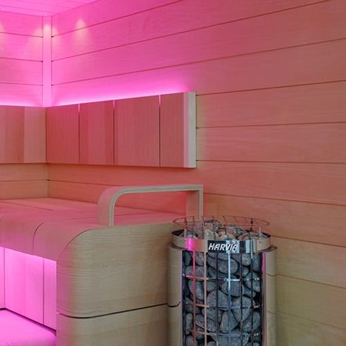Harvia Cilindro PC Electric Sauna Heater with Built-In Controls in Sauna Pink Light