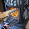Harvia GreenFlame Series Legend 240 15.9kW Wood Sauna Stove Feeding Fire