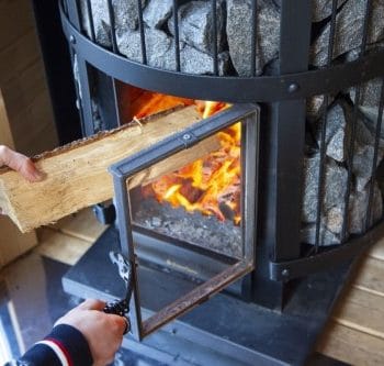 Harvia GreenFlame Series Legend 240 15.9kW Wood Sauna Stove Feeding Fire