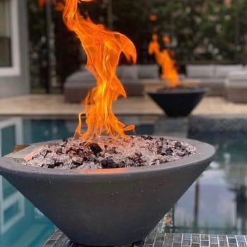 The Outdoor Plus Cazo Fire Bowl - GFRC Concrete on pool edge pillars