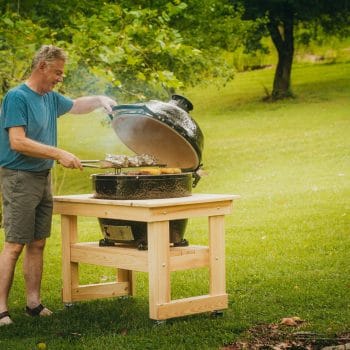 Charcoal Primo Grill being used while camping