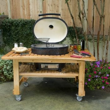 Charcoal Primo Grill on a movable wooden table
