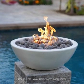 The Outdoor Plus Sedona Fire Bowl - GFRC Concrete On A Granite pillar base by a pool
