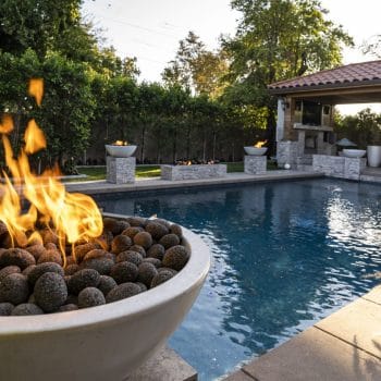 The Outdoor Plus Sedona Fire Pit - Narrow Ledge - GFRC Concrete by a Pool