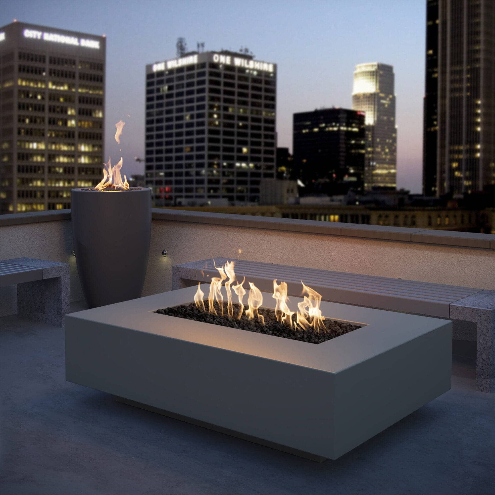 The Outdoor Plus Cabo Linear Fire Pit on a rooftop lounge