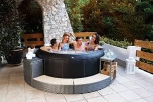 MSPA PREMIUM Super Camaro Hot Tub on patio with 4 people