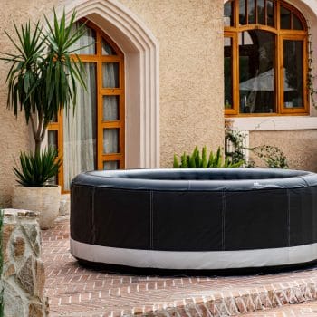 MSPA PREMIUM Super Camaro Hot Tub next to house