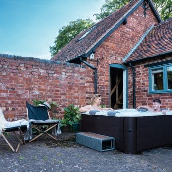 MSpa Frame Series Tribeca — Premium 6-Person Portable Hot Tub & Spa Lifestyle Photo backyard on concrete