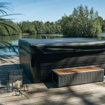 MSpa Frame Series Oslo Hot tub cover and bench next to lake