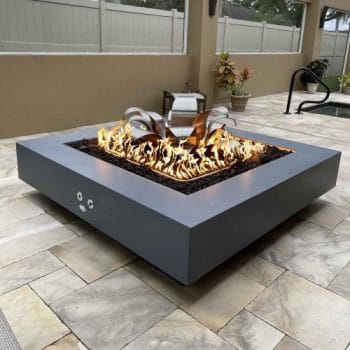 The Outdoor Plus Cabo Square Fire Pit next to Hot Tub
